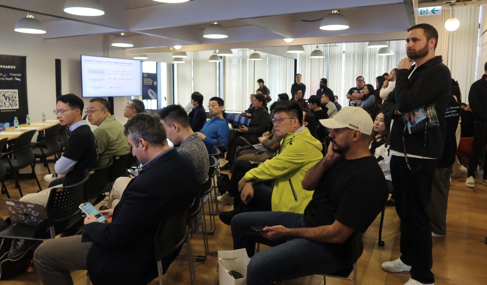 Attendees at a Buildify event listening to a Pharos session